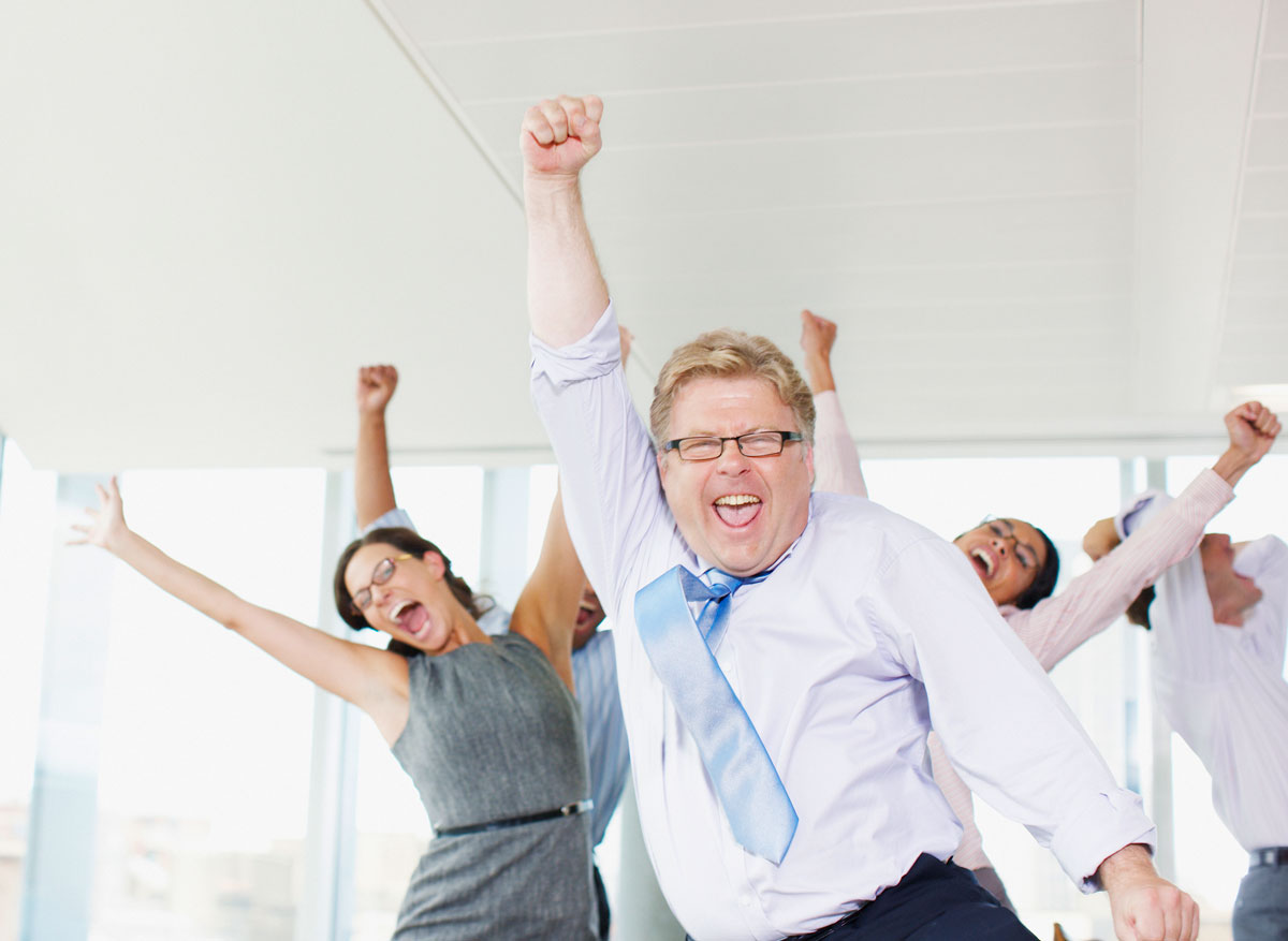 cheering-employees-on-the-right-1200x877 Excited Employees Jumping From Winning An Award