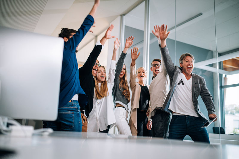 Group of business people celebrating at the office