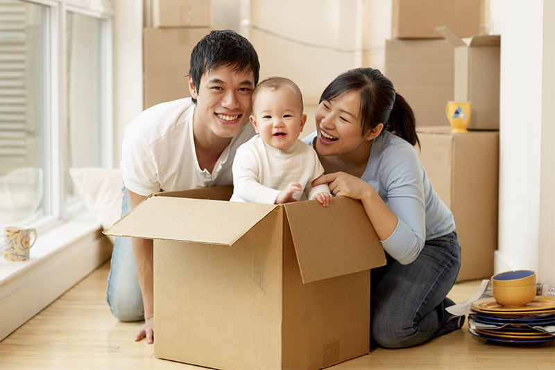 Happy family with baby in new house