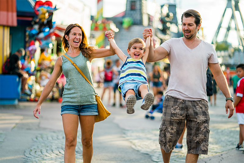 Happy Family Enjoying Summer Day An Amusement Park