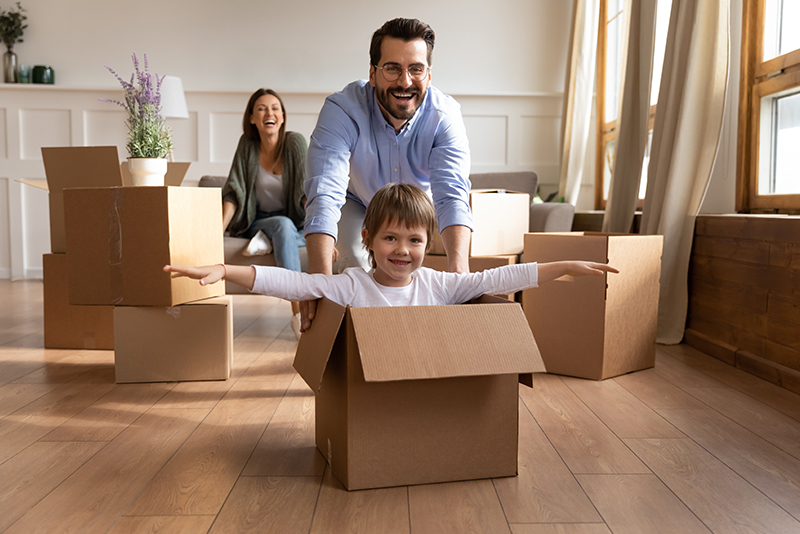 Happy Family Celebrating Moving Into New Home