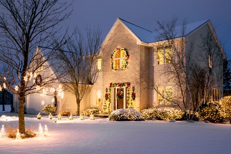 Home With Festive Holiday Lighting and Snow