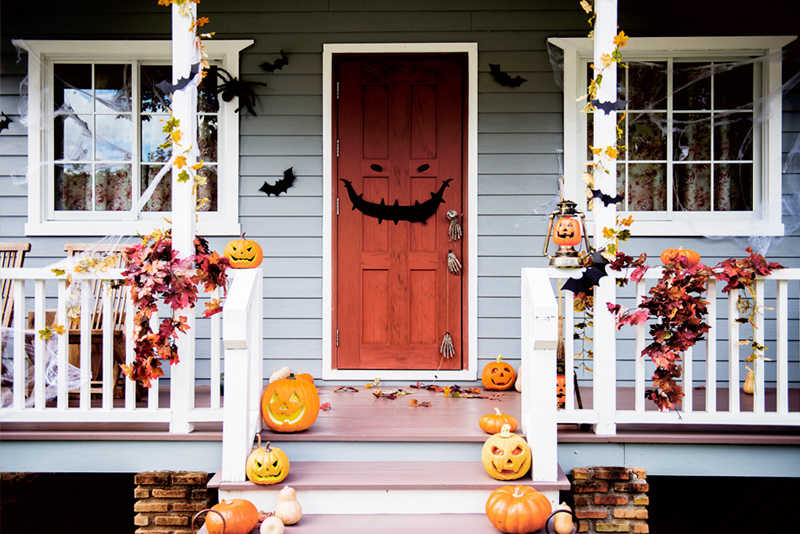 Halloween decor on porch of classic home
