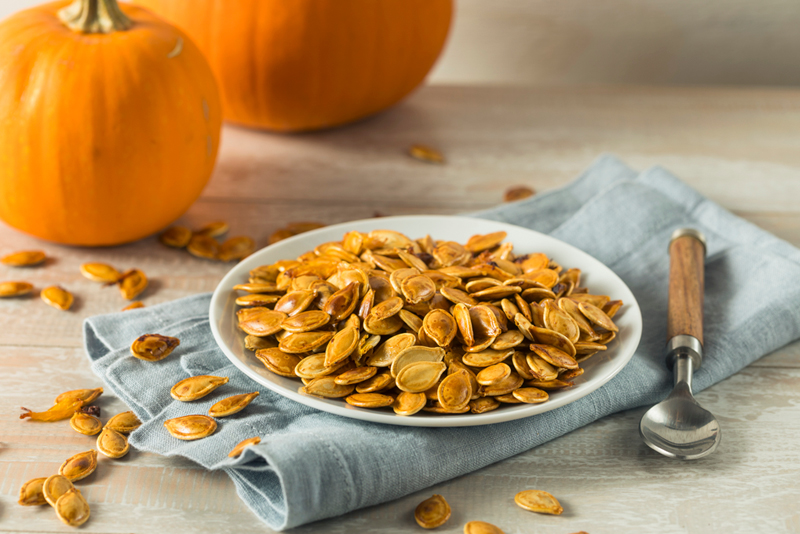 Pumpkins and pumpkin seeds on a table