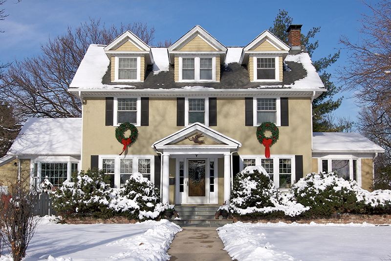Beautiful historic home in winter with snow