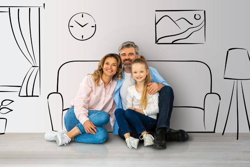 Parents And Daughter Sitting Together And Hugging while Dreaming About Own House, posing over Interior Sketch