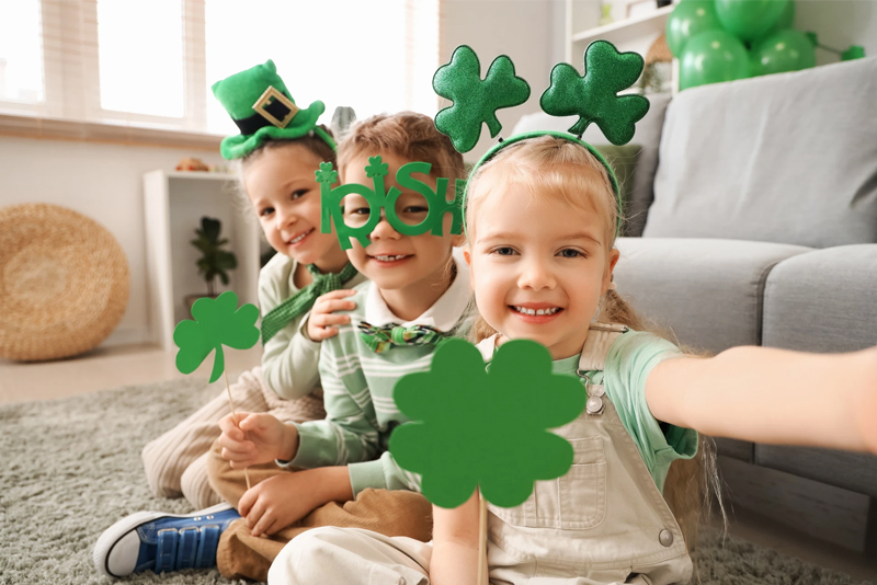 Young kids in green St Patricks Day outfits