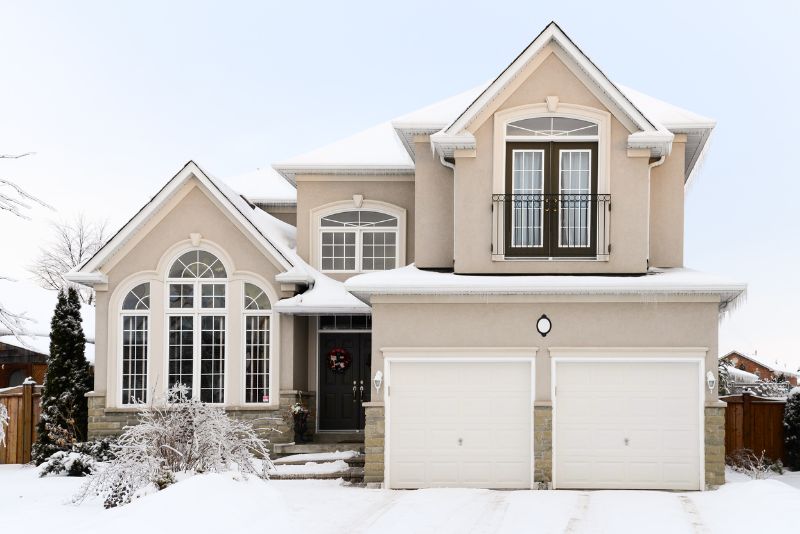 Exterior view of home in winter with snow