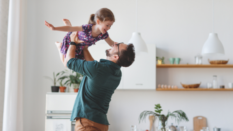 ITM photos Family laying on floor in living room with dog and child