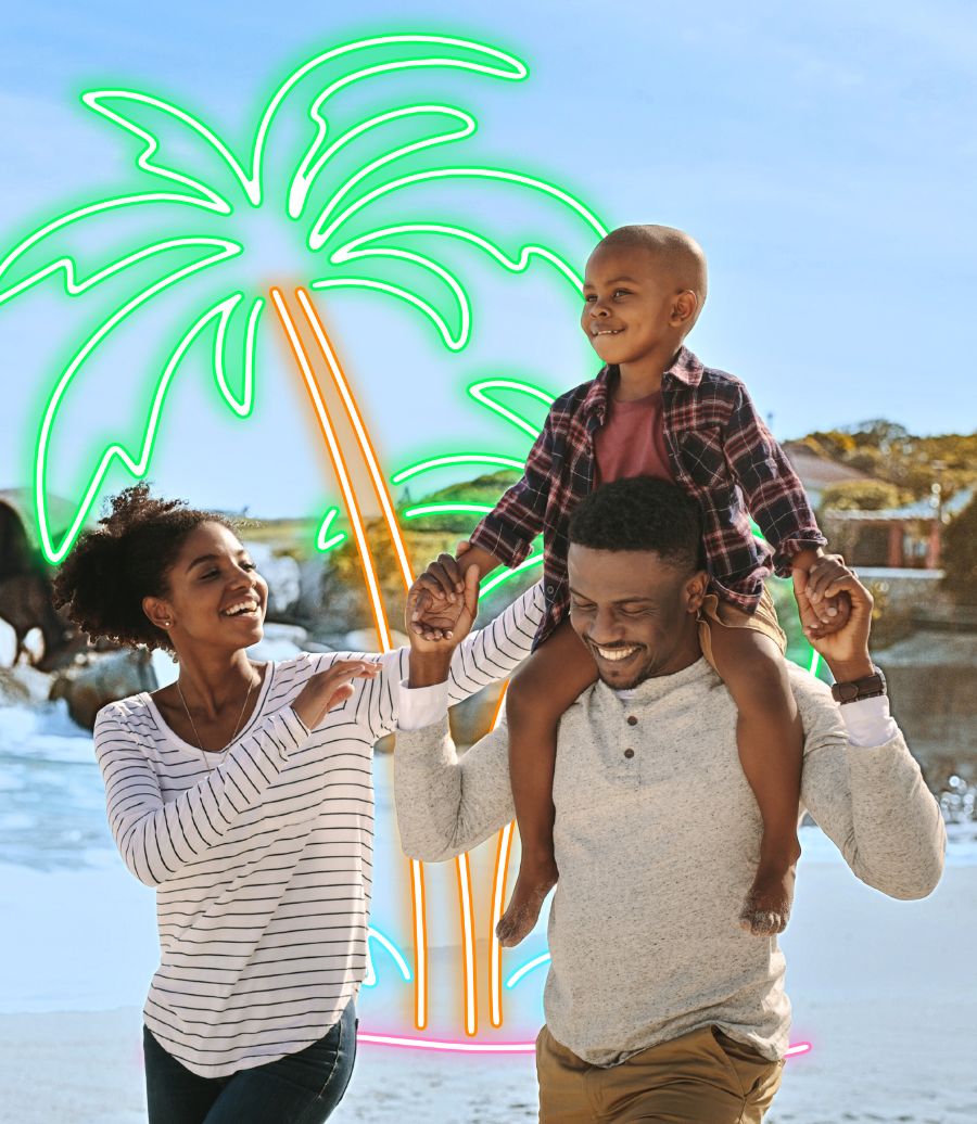 summer-ameriwallet-900x1036 African American family walking along the beach with son on dad's back